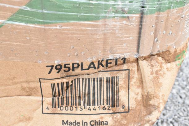 Damaged cardboard box with barcode 00015441629, marked "795PLAKFT1." Label reads "Made in China." Wrapped in plastic with water droplets.
