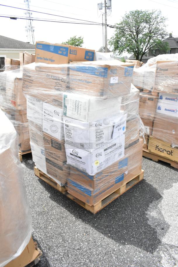 Pallet of boxed Lavex toilet paper and plastic cutlery packs. Items wrapped in plastic, indicating bulk quantity and new condition.