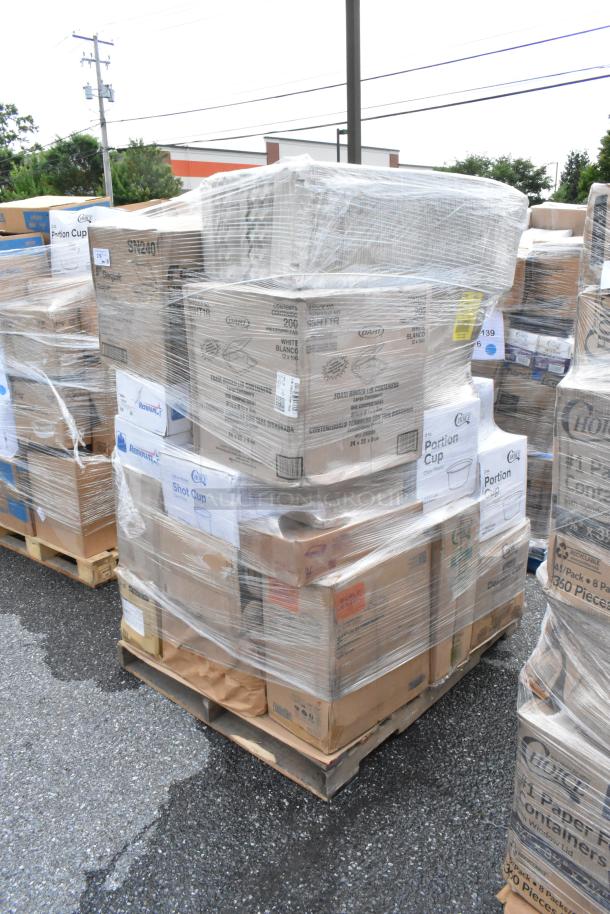 Pallet with wrapped boxes labeled with brands like Dart and Comet, containing portion and shot cups, in good condition.