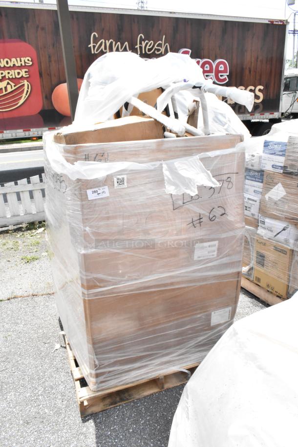 Pallet of mixed items wrapped in plastic, labeled "#62", condition unknown. Includes boxes and folded items on top.