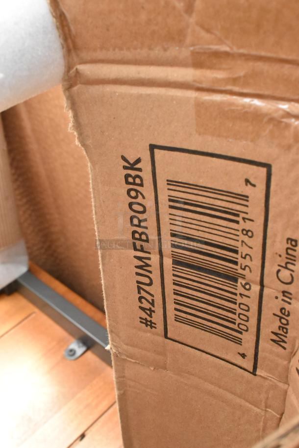 Cardboard box with printed barcode and code #427UMFBR09BK. Marked "Made in China." Box appears slightly damaged.