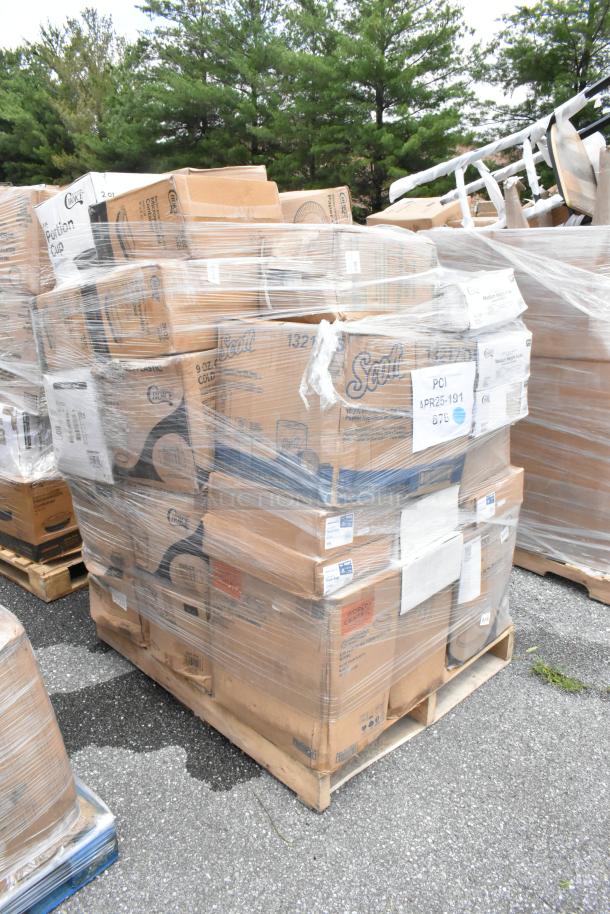 Pallet of boxed Scott paper towels wrapped in plastic. Brand labels and item codes visible. Suitable for bulk buyers.
