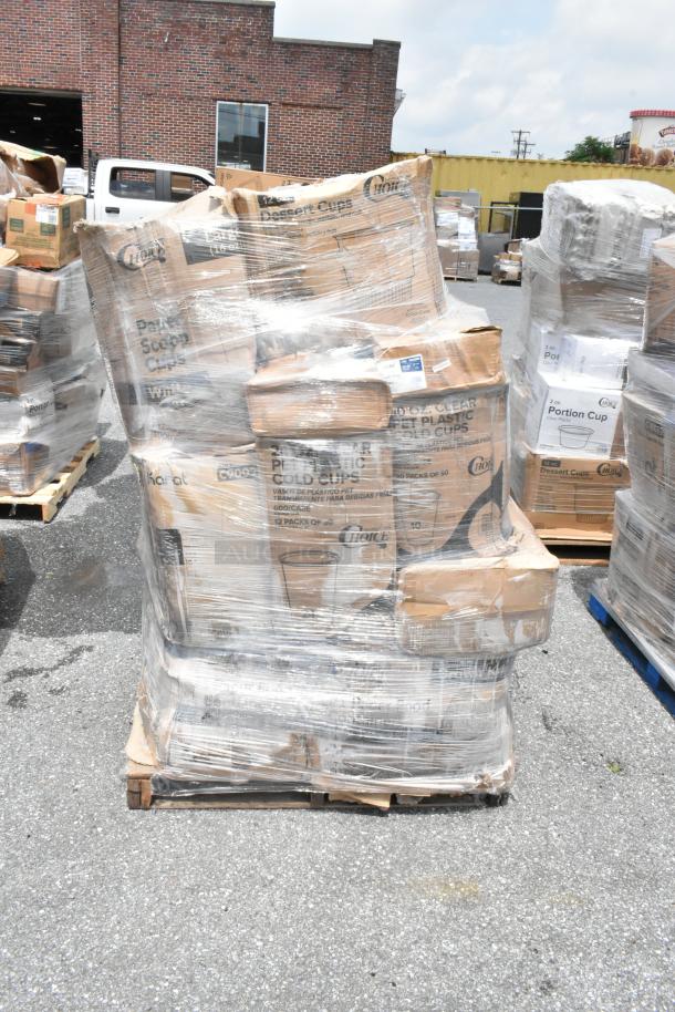Pallet wrapped in plastic, containing boxes of disposable plastic cups. Boxes labeled "Karat" and "Choice," assorted sizes.