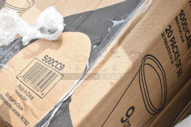 Cardboard box labeled "500CC9" containing disposable cups, 1000 per case. Some damage visible, sealed with plastic wrap. Made in China.
