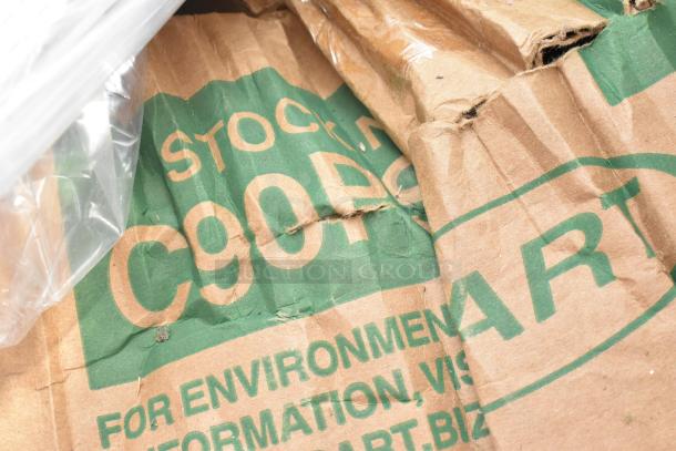 Close-up of a crumpled brown paper bag with visible text "C90P" and partial branding, indicating possible packaging material.