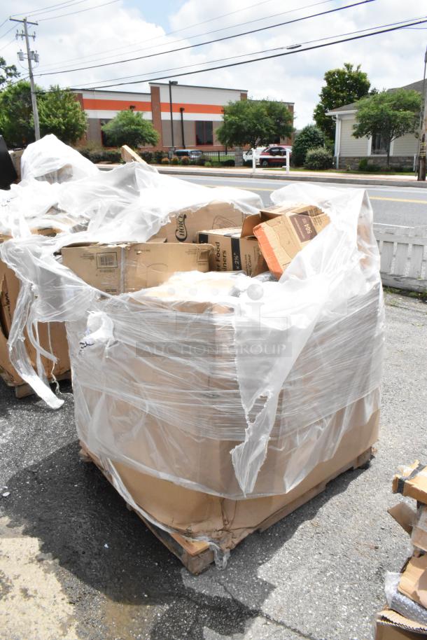 Large pallet of assorted cardboard boxes wrapped in plastic, some boxes labeled "Food Liners." Ideal for recycling.