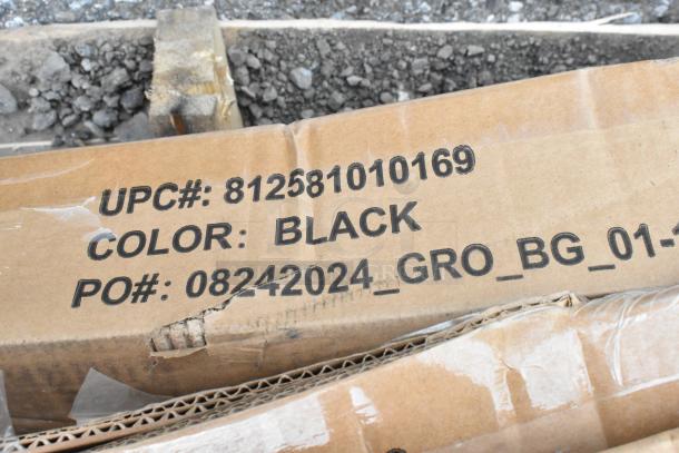 Cardboard box stamped with UPC 812581010169, color Black, PO 08242024_GRO_BG_01, slight wear visible.
