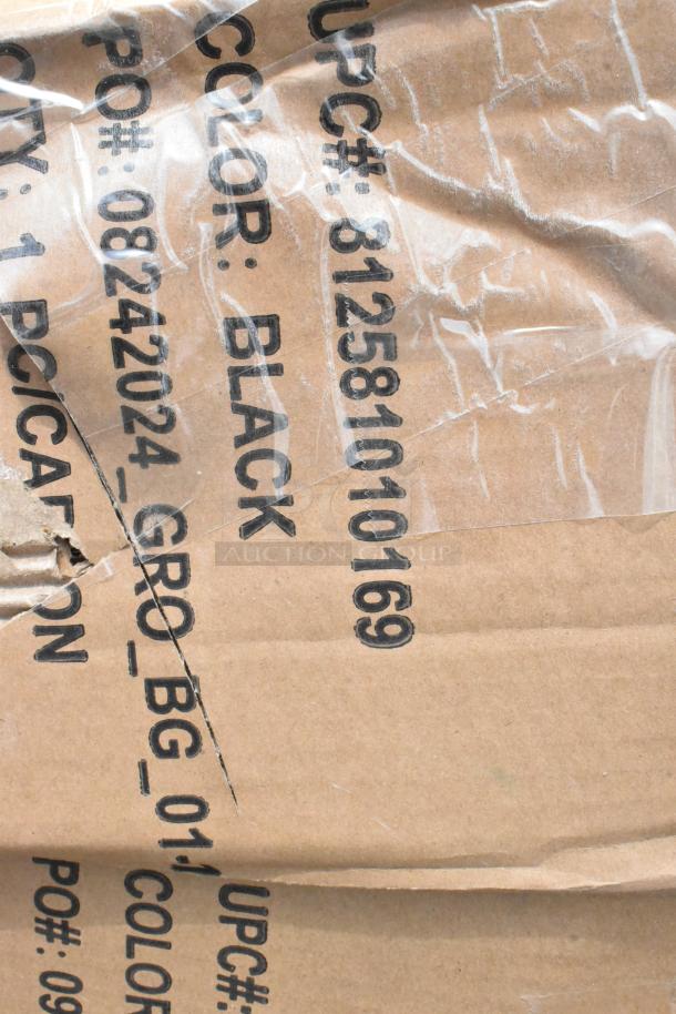 Close-up view of packaging with markings: UPC# 812581010169, Color: Black, PO# 081242024. Cardboard and plastic wrap.