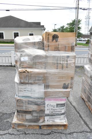 Pallet of assorted boxed items, including paper food containers and napkins, wrapped in plastic, labels visible.