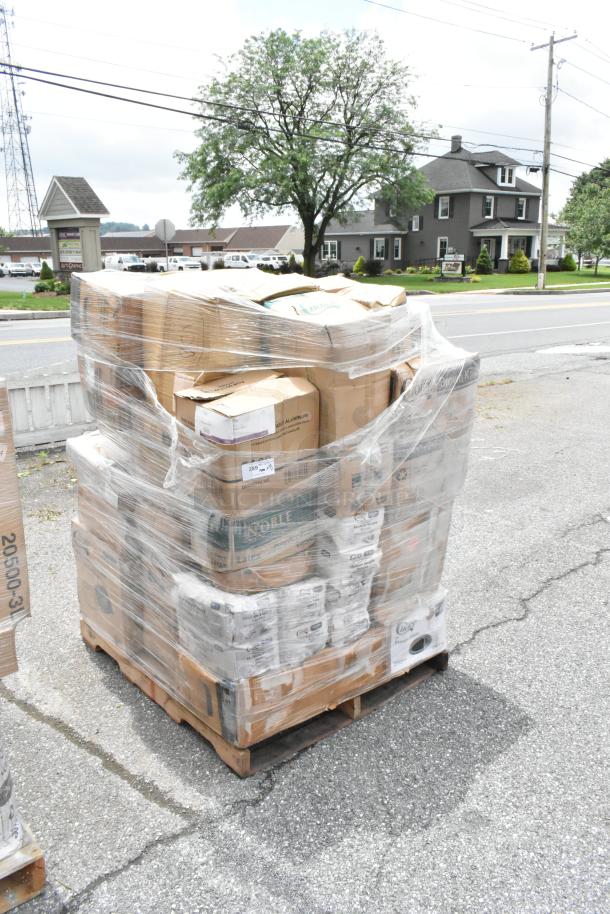 Pallet of assorted boxes shrink-wrapped for auction. Various product labels visible, indicating mixed contents. Appears in used condition.