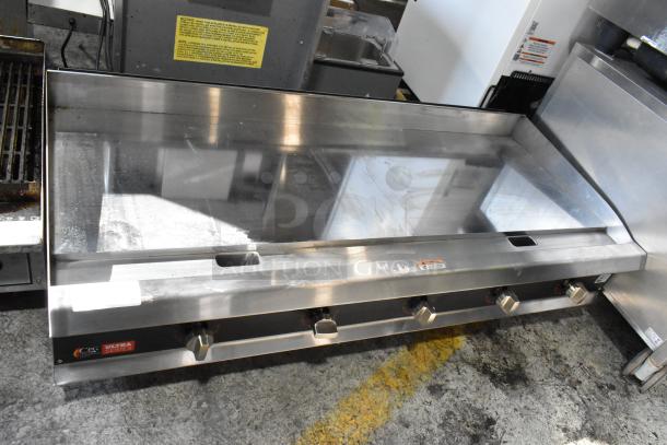 Commercial stainless steel flat-top griddle, four control knobs, minor surface wear, CPG Ultra Series label visible.