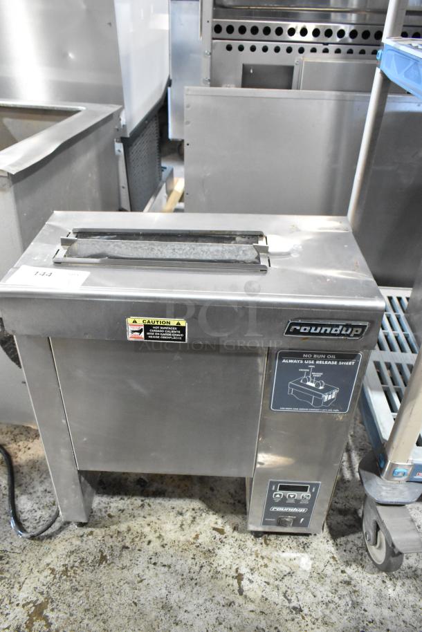 Roundup hot dog bun toaster, stainless steel, caution label warning of hot surfaces, digital controls, good condition.