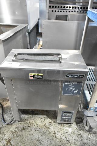 Roundup hot dog bun toaster, stainless steel, caution label warning of hot surfaces, digital controls, good condition.