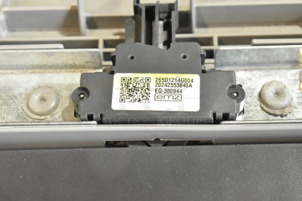 Black electronic component labeled "265D1214G004, 20242553840A, EG-380944" with a QR code, in good condition.