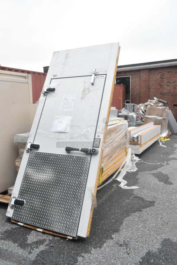 BRAND NEW SCRATCH AND DENT! Kolpak floorless walk-in refrigerator box for Domino's, featuring Kolpak 84" Clear Vu swing doors. Potential missing parts.