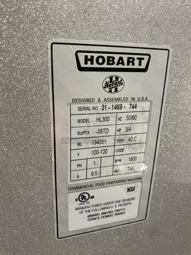 Hobart commercial food preparing machine label, Model HL300, Serial 31-1469-744, 3/4 HP, 1800 RPM, NSF certified.