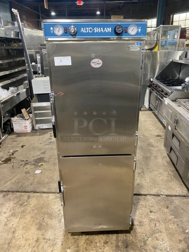Alto-Shaam commercial oven, stainless steel, dual doors, temperature gauges, Model HN2-7, good condition, industrial setting.