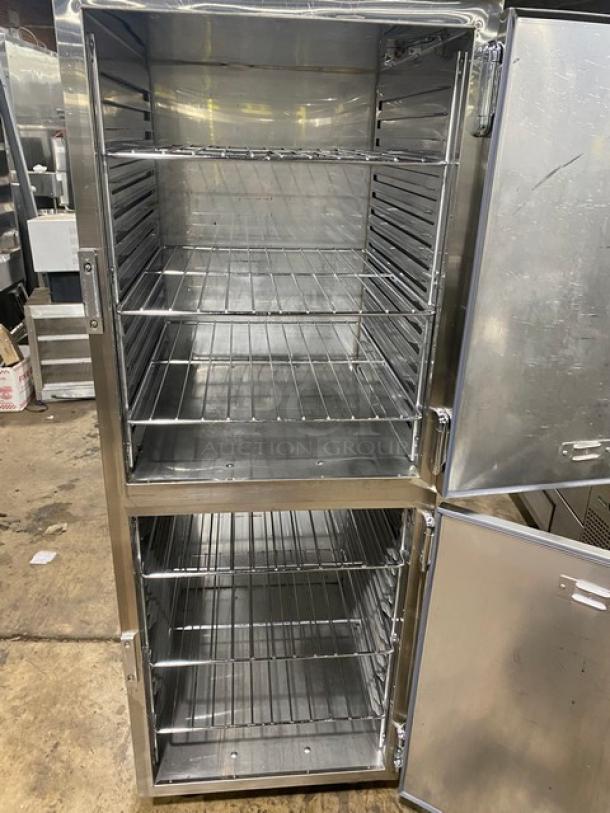 Stainless steel commercial kitchen cabinet with dual doors and multiple shelves. Clean interior, suitable for catering.
