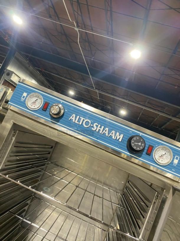 Alto-Shaam commercial oven in stainless steel, featuring dual dials and temperature gauges, clean and in good condition.