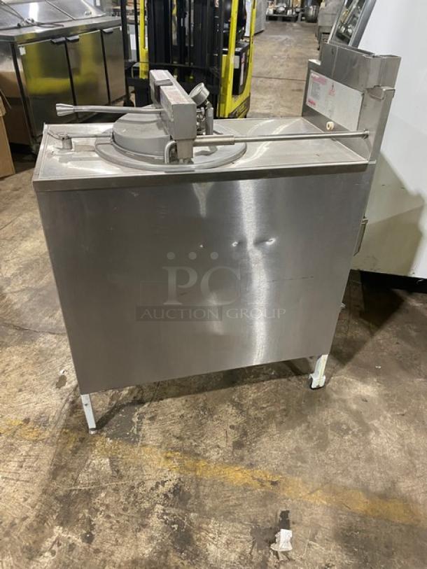Commercial stainless steel tilt skillet in fair condition, showing visible dents. Ideal for large-scale cooking.