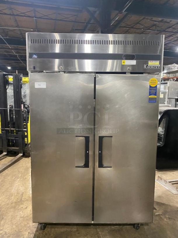 Commercial stainless steel refrigerator with two doors, Everest brand, model ESR2-D, good condition, energy-efficient label.