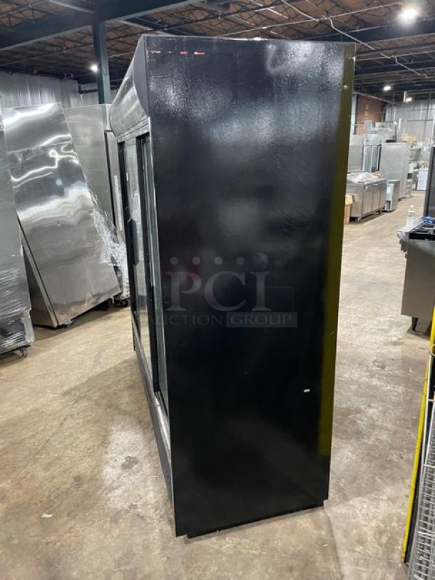 Commercial black display refrigerator, side view, showcasing a sleek design with glass doors. Appears in good condition.