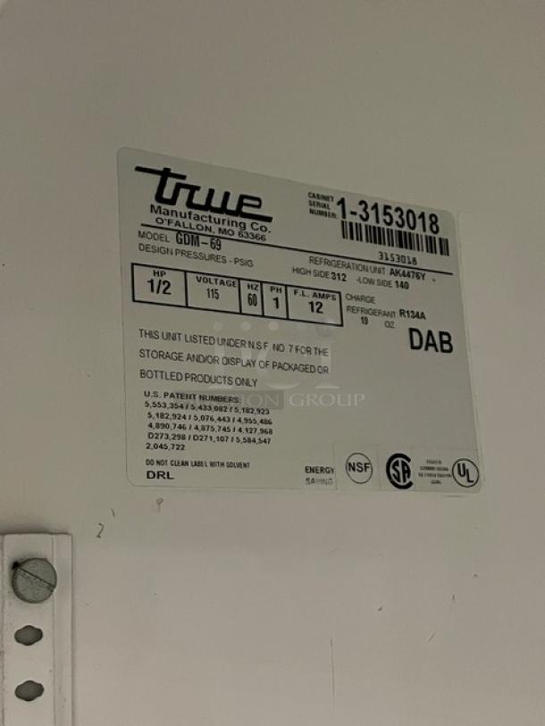 Label on True Manufacturing commercial refrigeration unit, Model GDM-69, showing specifications and certifications.