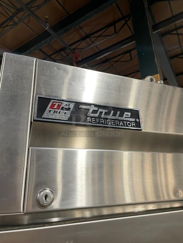 Stainless steel True refrigerator, model T-49, with brand logo and markings, in excellent condition.