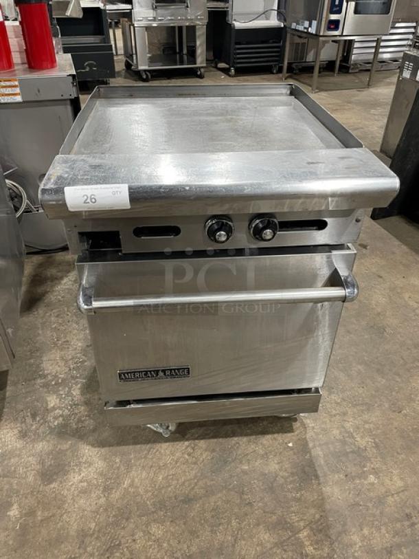 American Range commercial griddle with two control knobs, stainless steel, built-in oven, model label visible, good condition.