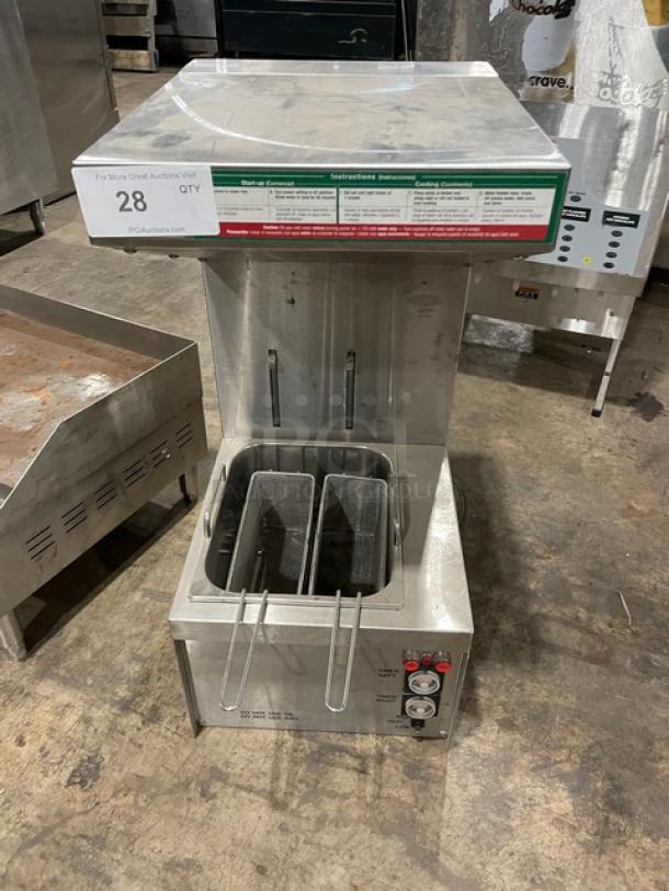 Commercial-grade deep fryer with dual baskets, stainless steel, visible control panel, item tag labeled "28".