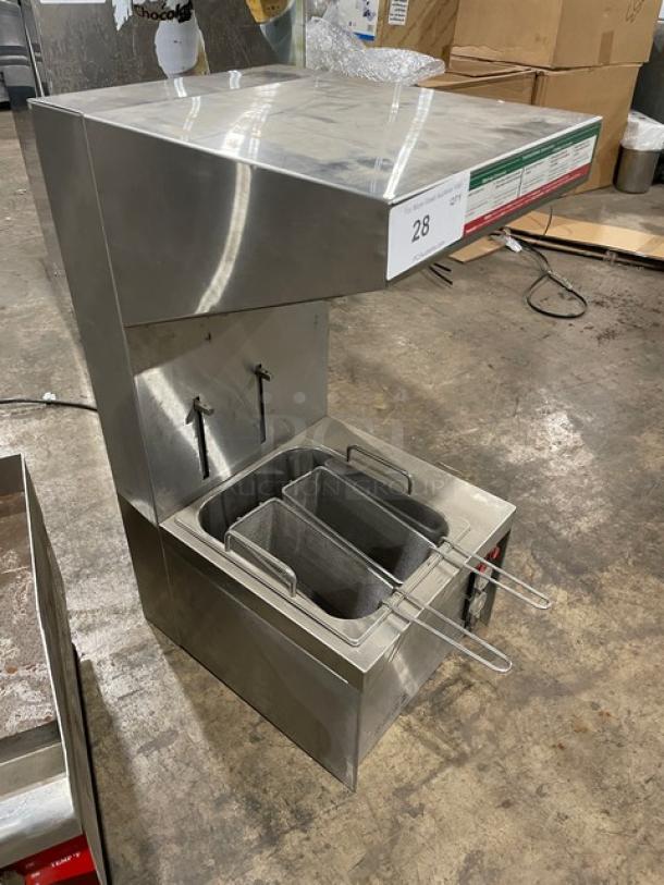 Commercial deep fryer with dual baskets, stainless steel, good condition, power cable visible. Auction tag reads "28".