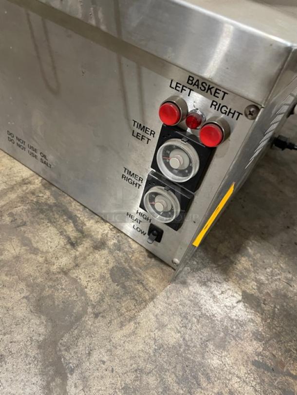 Stainless steel commercial fryer control panel, dual basket controls, left/right timers, high/low heat settings, used condition.