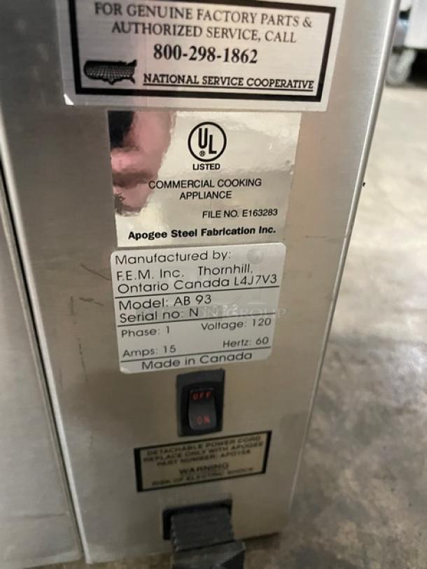 Commercial cooking appliance by Apogee Steel Fabrication Inc., model AB 93. UL listed. Voltage 120, Made in Canada.