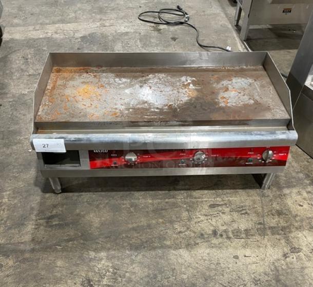 Commercial griddle with rusty surface, three control knobs, and power cable. Item number 27. Visible wear indicates used condition.