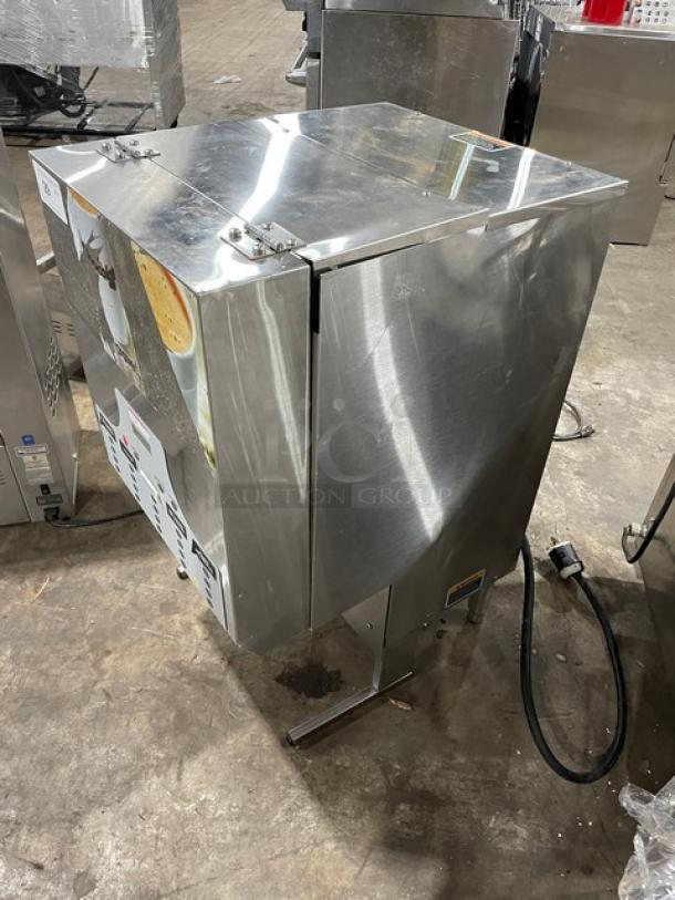 Commercial stainless steel beverage dispenser, showing side and top views, with visible power cord and exterior markings.