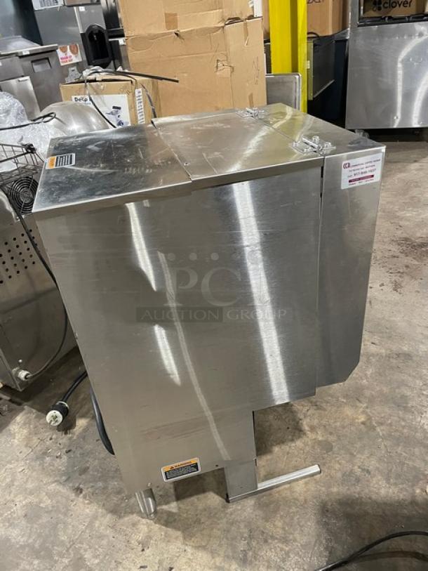 Industrial stainless steel meat mixer with lid, electrical cord, and labeled safety warnings, in used condition.