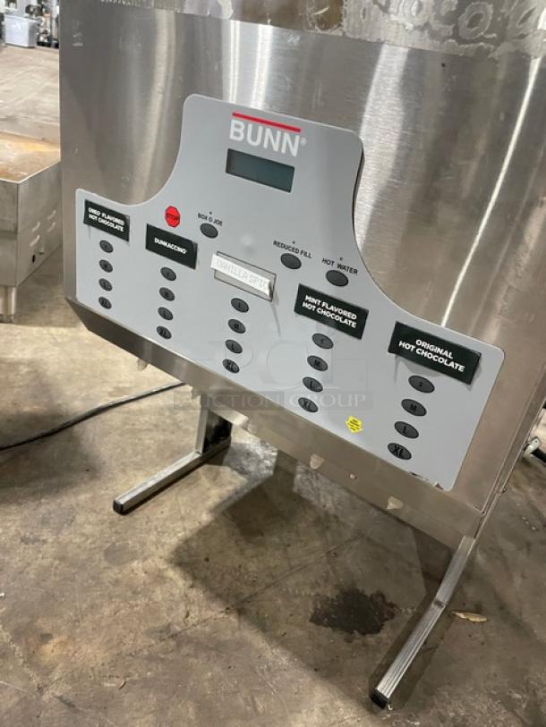 Bunn hot beverage dispenser with stainless steel body, multiple buttons for drink options, in used condition.