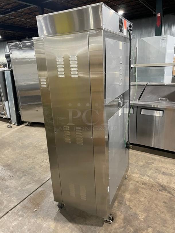 Stainless steel commercial food warming cabinet on wheels, featuring ventilation panels and visible control panel. Excellent condition.