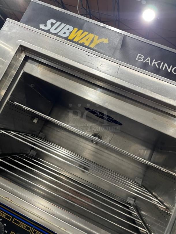 Commercial Subway baking oven, stainless steel, multiple shelves, used condition with visible controls, suitable for restaurant use.