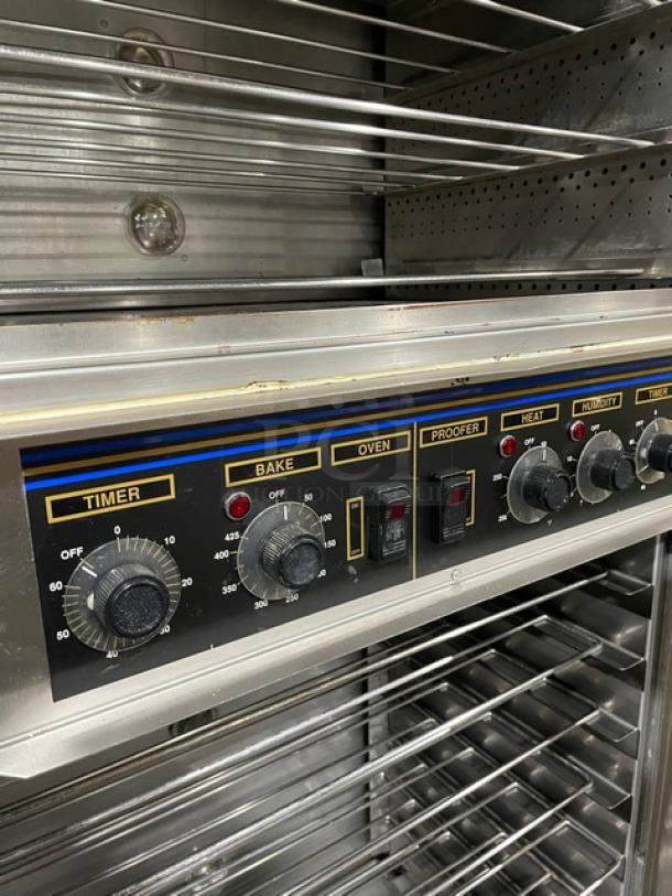 Commercial oven with stainless steel racks and control panel featuring timer, bake, oven, proofer, heat, and humidity settings.