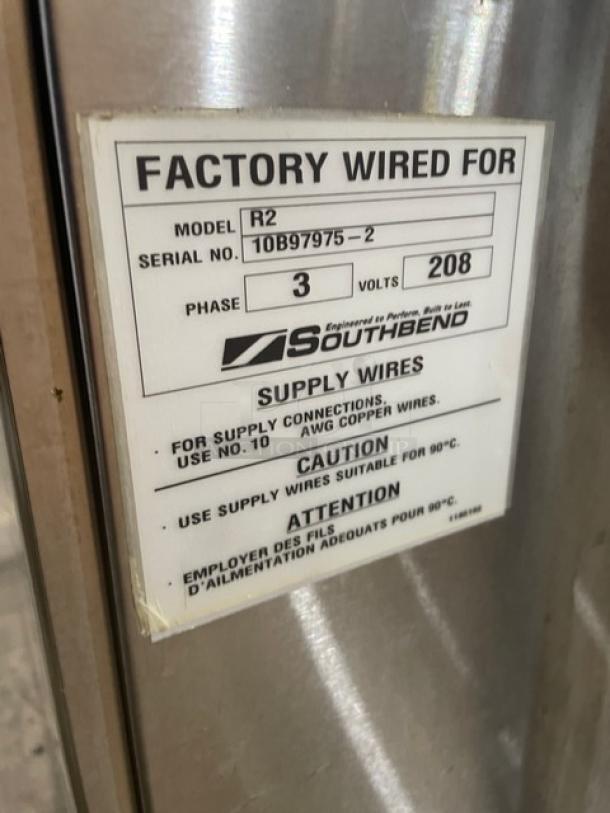 Label on Southbend equipment, Model R2, Serial No. 10B97975-2, Phase 3, 208 volts. Indicates wiring and safety instructions.