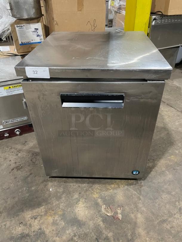 Stainless steel commercial freezer, compact, used condition, model 32, minor surface wear, visible ID tag and temperature control knob.