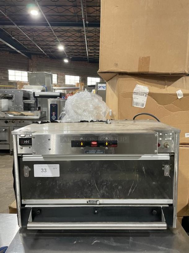 Commercial countertop toaster oven, stainless steel exterior, visible control panel, gently used condition, label reads "33 QTY."