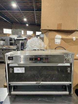 Commercial countertop toaster oven, stainless steel exterior, visible control panel, gently used condition, label reads "33 QTY."