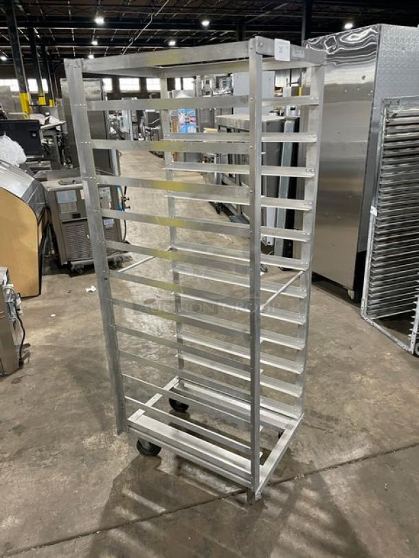 Metal bakery rack, 10-tier, stainless steel, on wheels, used condition, suitable for sheet pan storage, industrial kitchen.