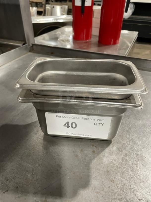 Stainless steel food pan, medium size, stackable design, durable condition. Label indicates quantity 40, visit PCIAuctions.com.