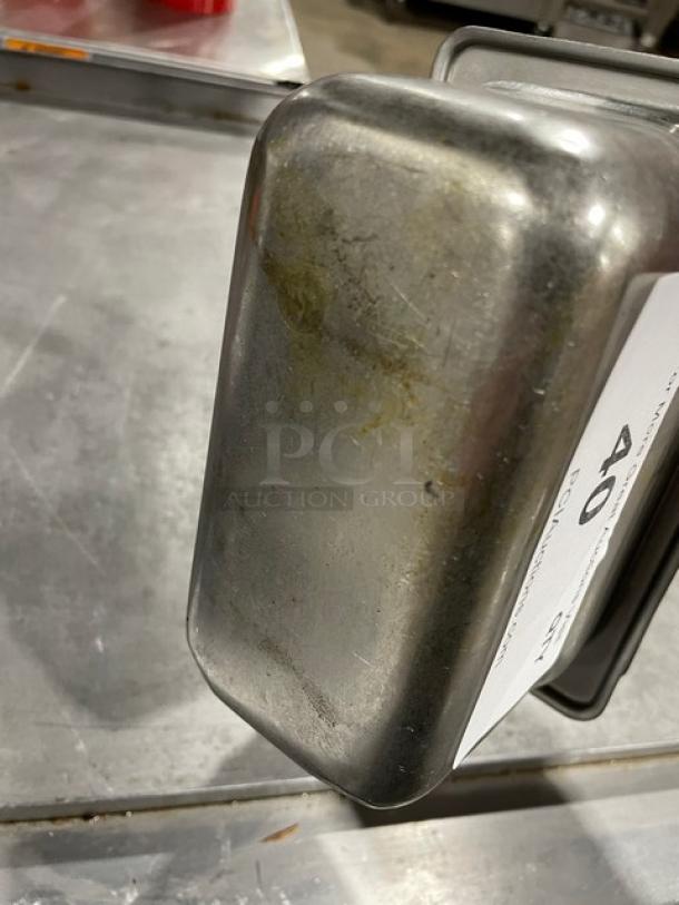 Vintage metal container with wear and patina, rectangular shape, auction tag marked "40," indicating lot number.