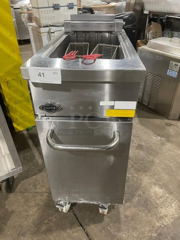 Empero commercial deep fryer with dual baskets, stainless steel, model marked as 41. Used condition, wheels for mobility.