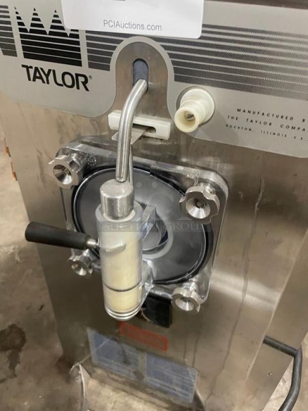 Taylor commercial soft serve machine, stainless steel, lever handle, label shows manufacturer in Rockton, Illinois, good condition.