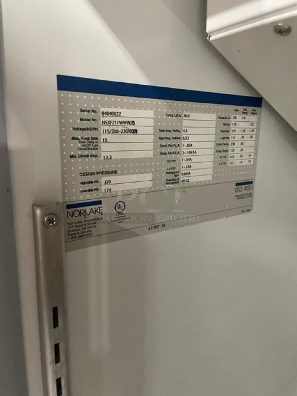Norlake refrigerator data plate showing model NS021WWW/0, voltage options, and design pressure specs. Serial number 04080822.